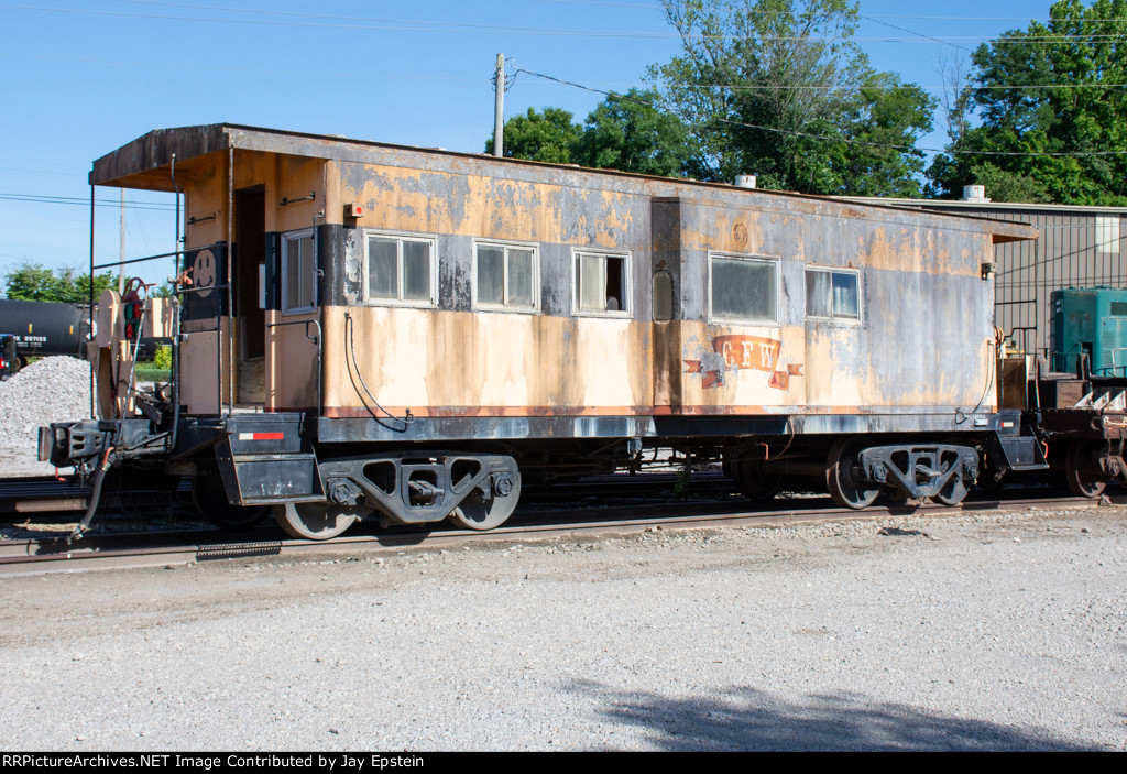 A bay window caboose sits in the Caney Fork & Western Yard 